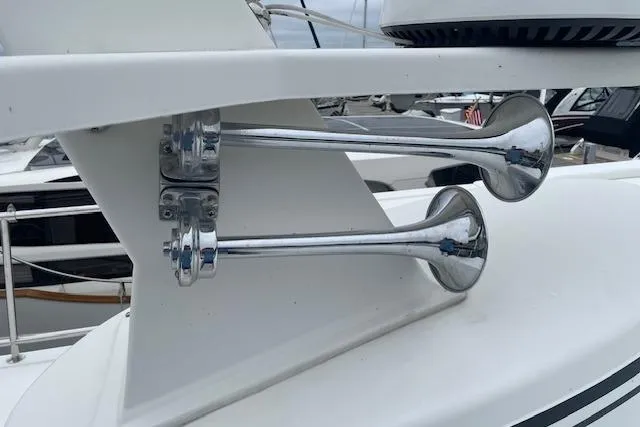  Yacht Photos Pics Chrome horns on 2018 American Tug 365 boat, docked in marina.