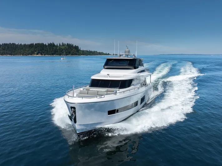 V68-612 / Now Available Yacht Photos Pics Luxurious 2025 Horizon V68 yacht cruising on a clear blue sea.