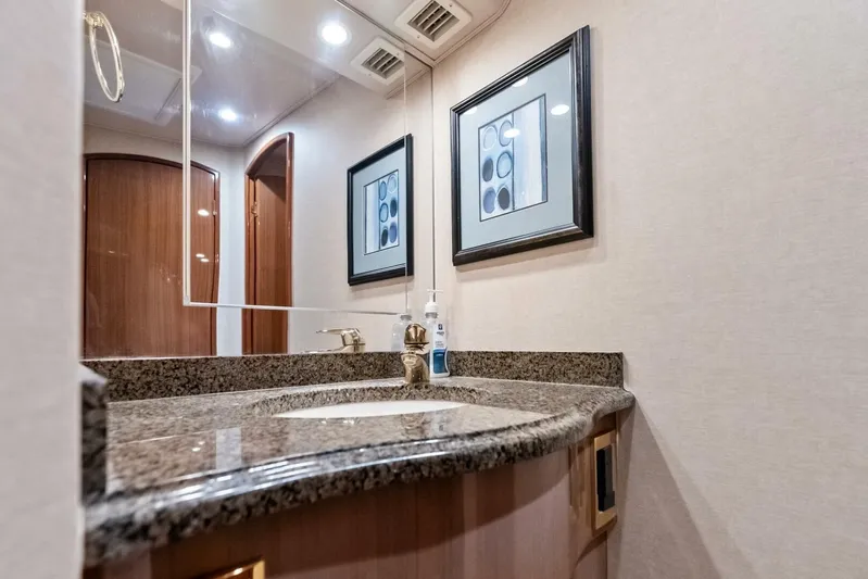 Cap'n Hook Yacht Photos Pics Luxurious bathroom interior of 2006 Viking 68 Enclosed Bridge yacht with granite countertop.