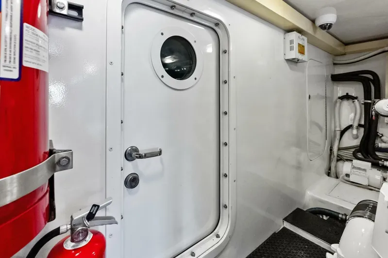 Cap'n Hook Yacht Photos Pics Engine room door of 2006 Viking 68 Enclosed Bridge yacht, featuring safety equipment.