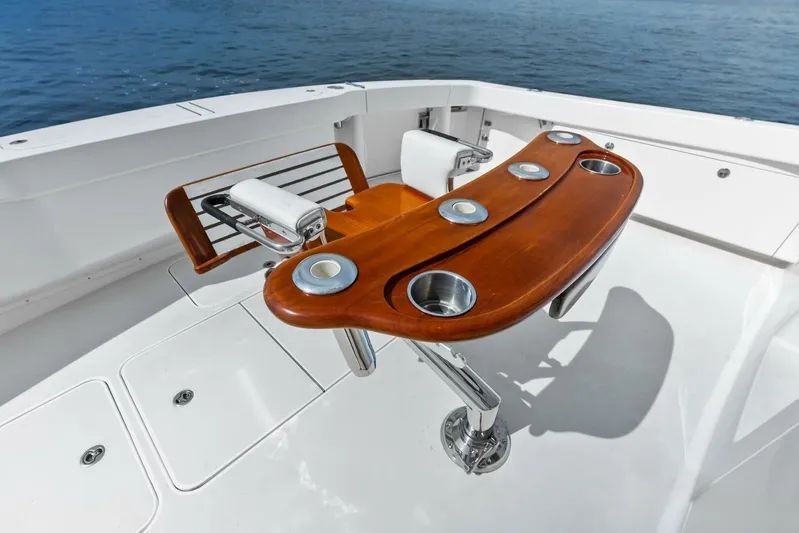 Cap'n Hook Yacht Photos Pics Luxury fishing chair on 2006 Viking 68 Enclosed Bridge yacht deck, overlooking ocean.