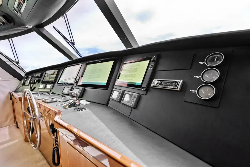Cap'n Hook Yacht Photos Pics 2006 Viking 68 Enclosed Bridge helm with advanced navigation systems and sleek design.