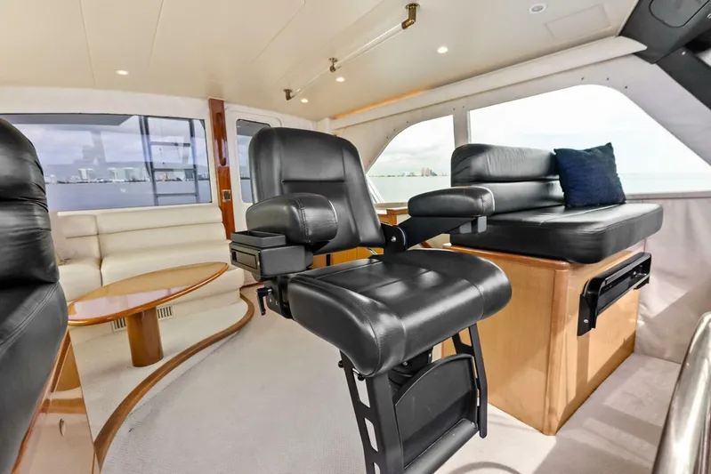 Cap'n Hook Yacht Photos Pics Luxurious interior of 2006 Viking 68 Enclosed Bridge yacht with leather seating.