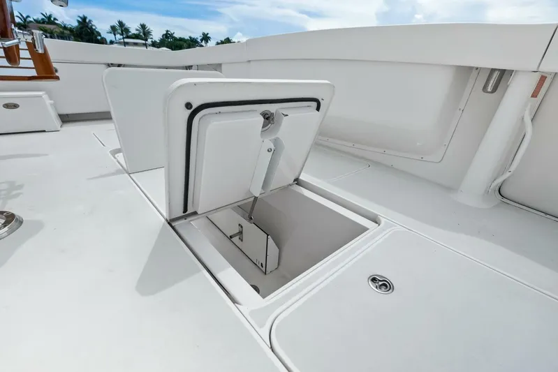 Cap'n Hook Yacht Photos Pics Open hatch on 2006 Viking 68 Enclosed Bridge yacht deck, with clear sky background.