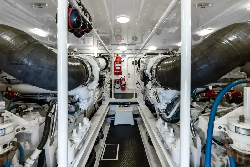 Cap'n Hook Yacht Photos Pics Engine room of 2006 Viking 68 Enclosed Bridge yacht, featuring dual engines and safety equipment.