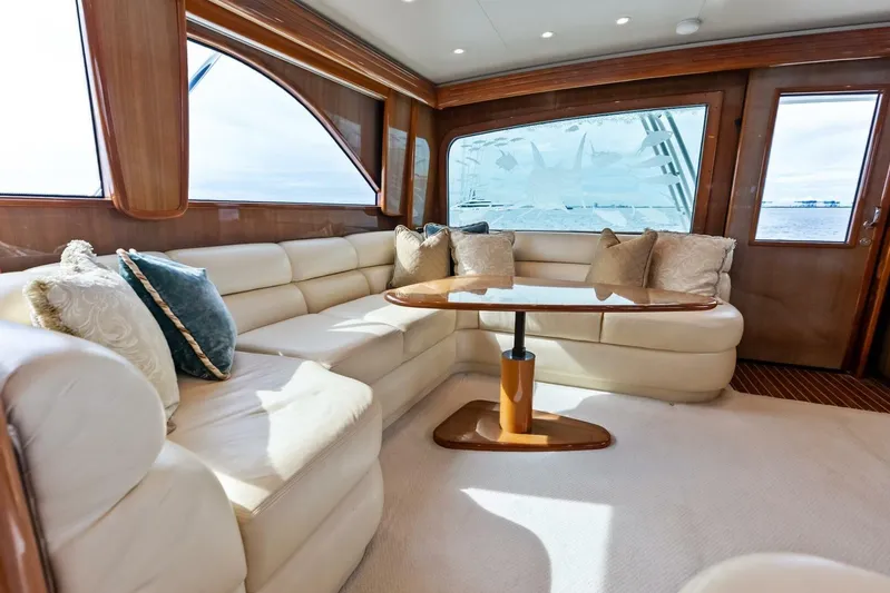 Cap'n Hook Yacht Photos Pics Luxurious interior of 2006 Viking 68 Enclosed Bridge yacht with plush seating and elegant decor.