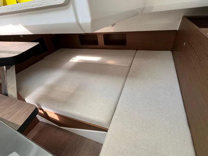  Yacht Photos Pics Interior cabin of 2019 Jeanneau Leader 9.0 WA with cushioned seating.