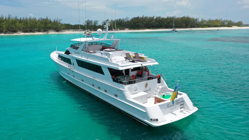 Island Time Yacht Photos Pics Broward 1991 Motor Yacht cruising in turquoise waters near a tropical island.