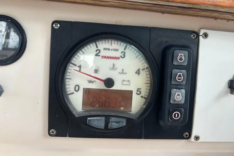 Blue Skies Yacht Photos Pics Yanmar RPM gauge on 1995 Island Packet 40 sailboat dashboard.