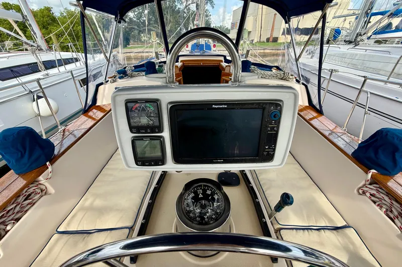 Blue Skies Yacht Photos Pics Cockpit of 1995 Island Packet 40 sailboat with navigation instruments and compass.