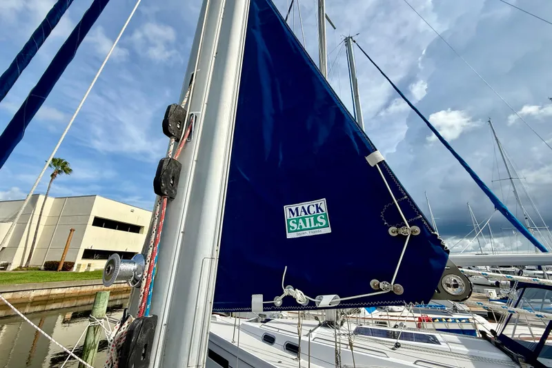 Blue Skies Yacht Photos Pics Sailboat mast with Mack Sails on a 1995 Island Packet 40, docked at marina.