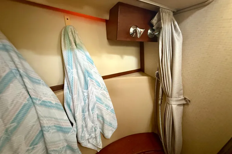 Blue Skies Yacht Photos Pics Interior of 1995 Island Packet 40 sailboat with hanging towels and shower area.