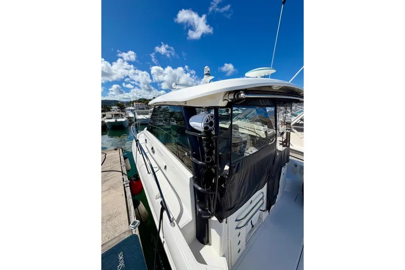  Yacht Photos Pics 2023 Boston Whaler 345 Conquest docked under a clear blue sky.