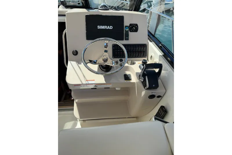  Yacht Photos Pics 2023 Boston Whaler 345 Conquest helm with Simrad navigation system.