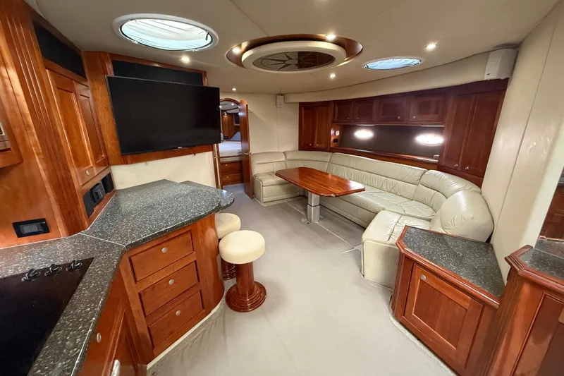  Yacht Photos Pics Luxurious interior of 2007 Cruisers Yachts 560 Express with leather seating and modern amenities.