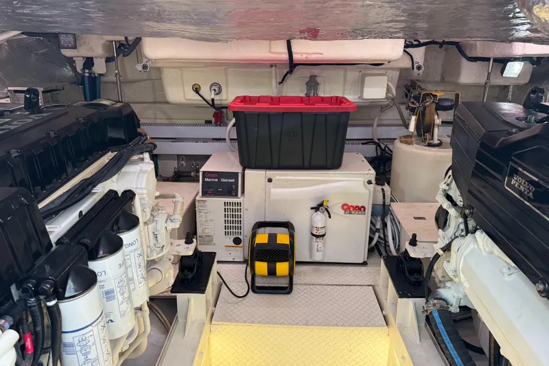  Yacht Photos Pics Engine room of 2007 Cruisers Yachts 560 Express with Onan generator and Volvo Penta engines.
