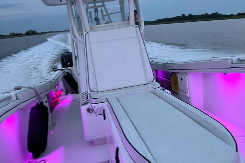  Yacht Photos Pics 2007 Yellowfin 36 boat with pink interior lights cruising on water.