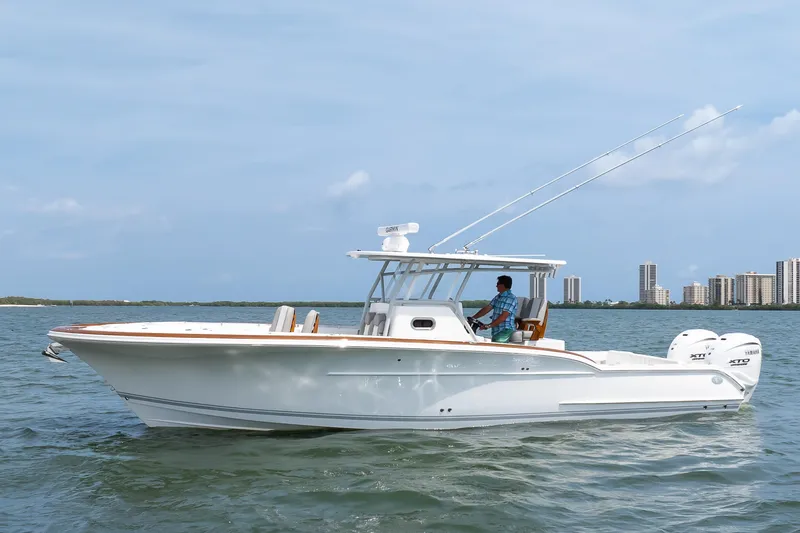  Yacht Photos Pics 2026 Buddy Davis 34 Center Console boat cruising on open water.