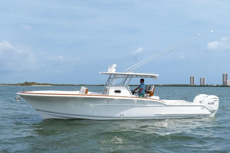  Yacht Photos Pics 2026 Buddy Davis 34 Center Console boat cruising on open water.