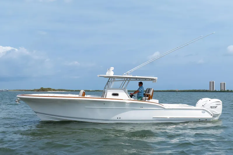  Yacht Photos Pics 2026 Buddy Davis 34 Center Console boat cruising on open water.