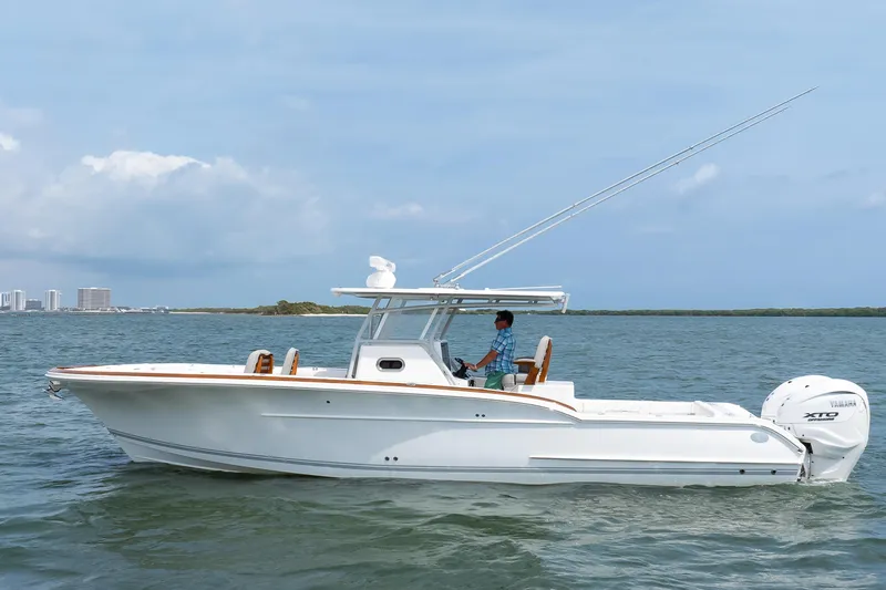  Yacht Photos Pics 2026 Buddy Davis 34 Center Console boat cruising on open water.