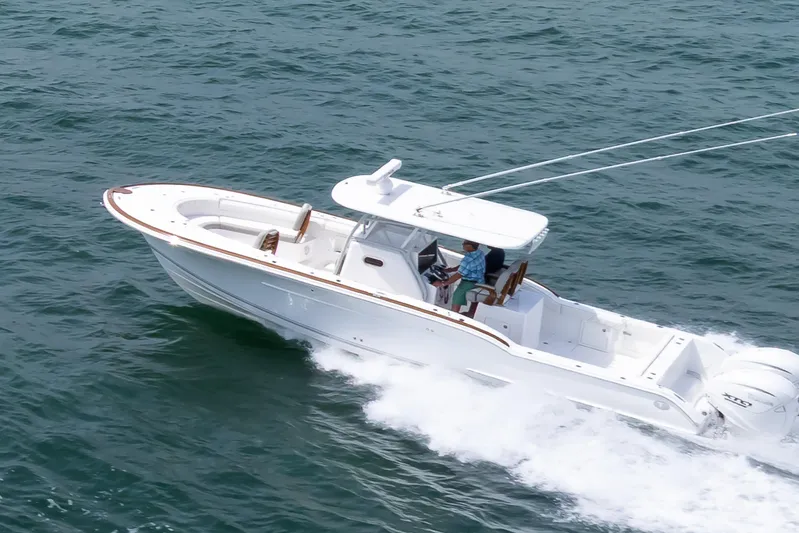  Yacht Photos Pics 2026 Buddy Davis 34 Center Console boat cruising on open water.