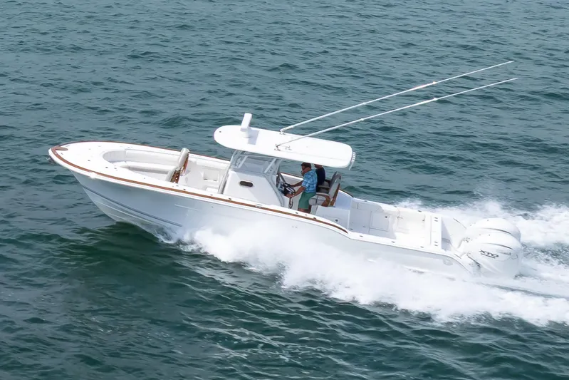  Yacht Photos Pics 2026 Buddy Davis 34 Center Console boat cruising on open water.