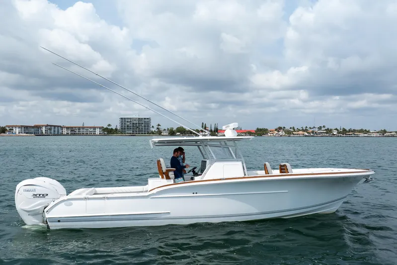  Yacht Photos Pics 2026 Buddy Davis 34 Center Console boat on water, featuring Yamaha XTO engine.
