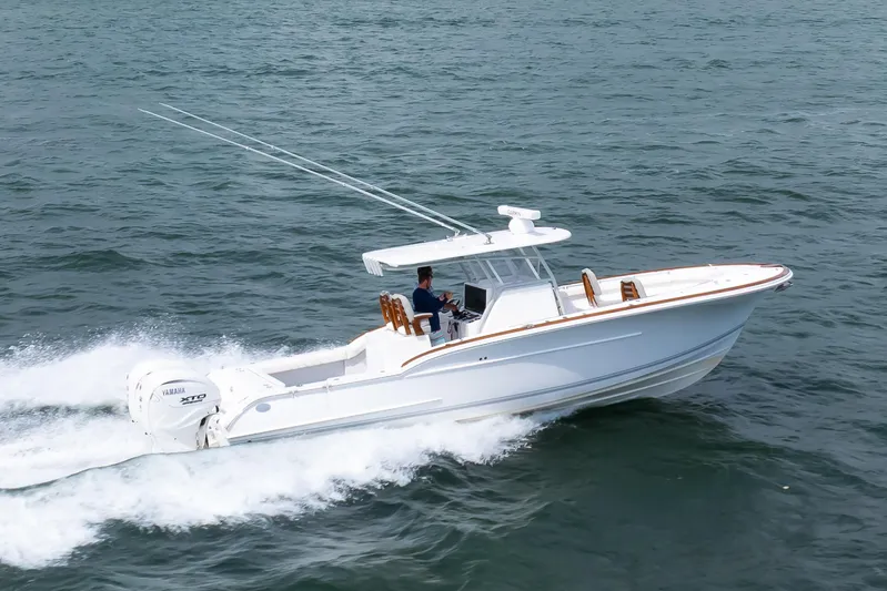  Yacht Photos Pics 2026 Buddy Davis 34 Center Console boat cruising on open water.