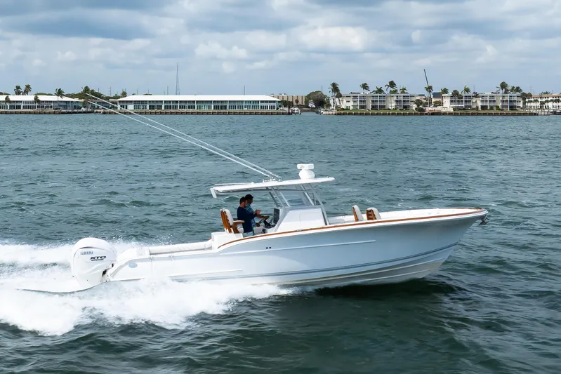  Yacht Photos Pics 2026 Buddy Davis 34 Center Console boat cruising on the water.