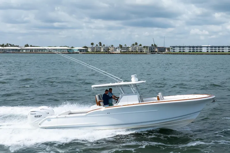  Yacht Photos Pics 2026 Buddy Davis 34 Center Console boat cruising on open water.