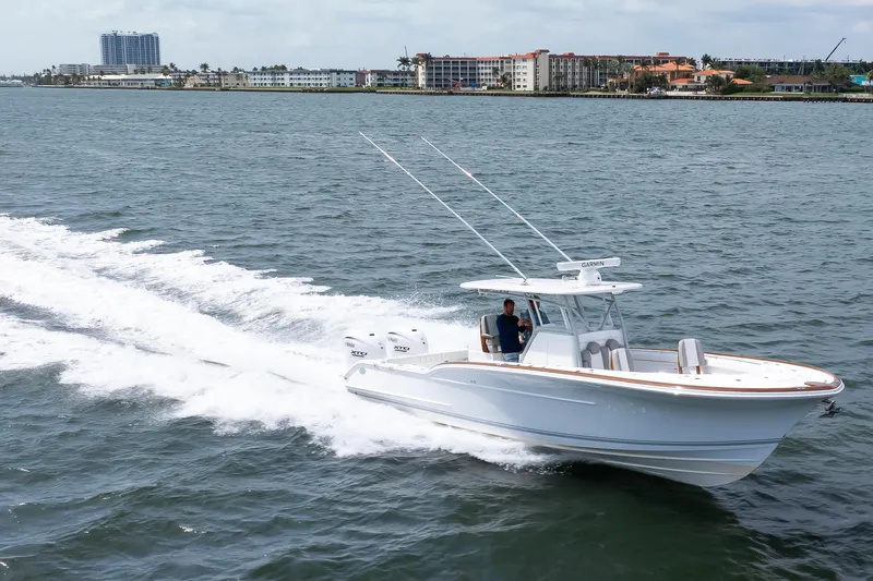  Yacht Photos Pics 2026 Buddy Davis 34 Center Console boat cruising on open water.