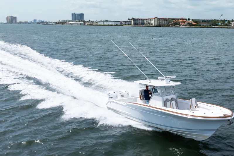  Yacht Photos Pics 2026 Buddy Davis 34 Center Console boat cruising on open water.