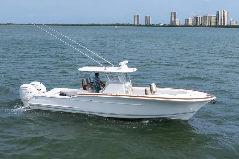  Yacht Photos Pics 2026 Buddy Davis 34 Center Console boat cruising on open water.