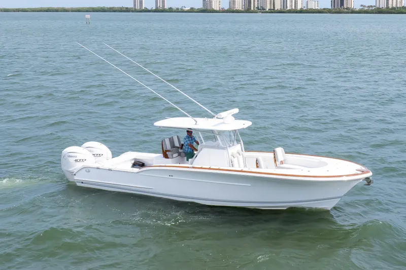  Yacht Photos Pics 2026 Buddy Davis 34 Center Console boat cruising on open water.