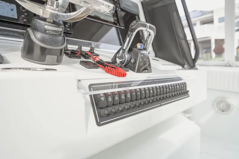  Yacht Photos Pics Control panel of a 2018 Freeman 37 VH boat, featuring switches and steering.