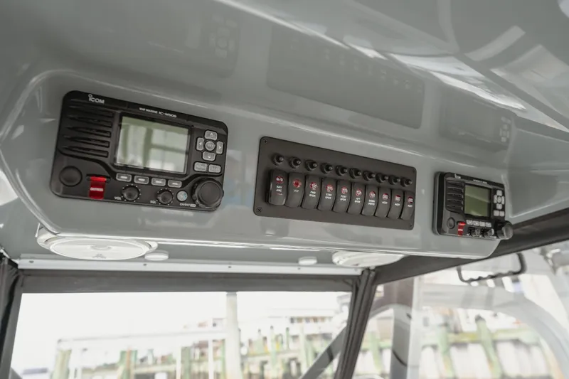  Yacht Photos Pics Control panel of a 2018 Freeman 37 VH boat with radio and switches.
