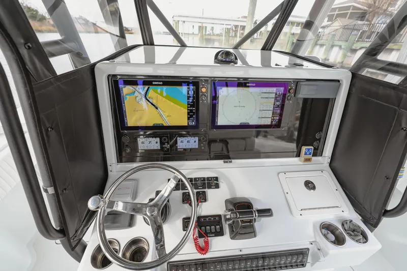  Yacht Photos Pics 2018 Freeman 37 VH boat dashboard with navigation screens and steering wheel.