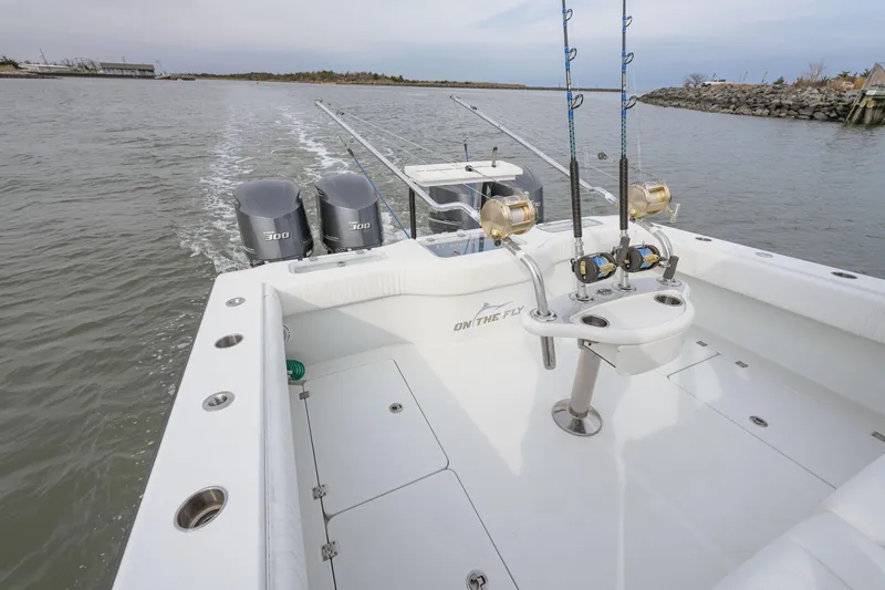  Yacht Photos Pics Freeman 37 VH 2018 boat with fishing rods and dual engines on open water.