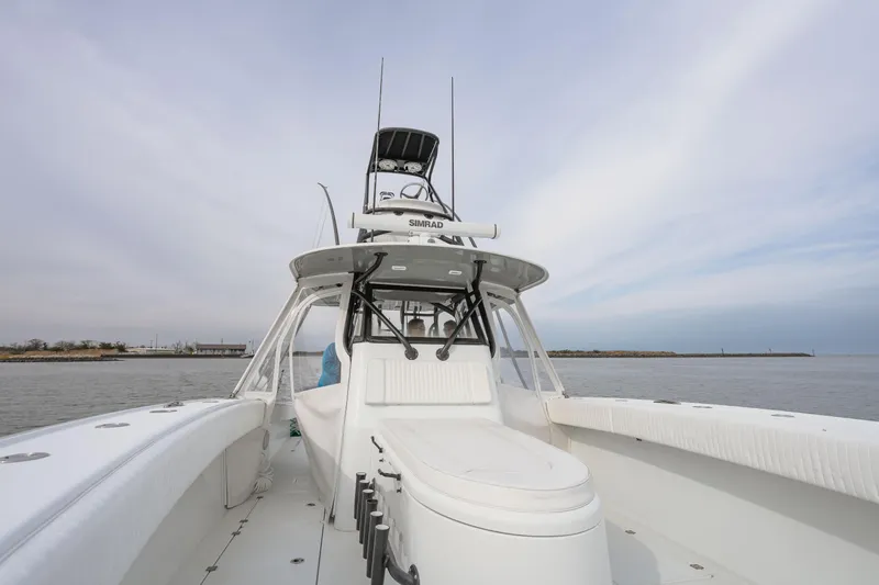  Yacht Photos Pics 2018 Freeman 37 VH boat on calm water under a cloudy sky.