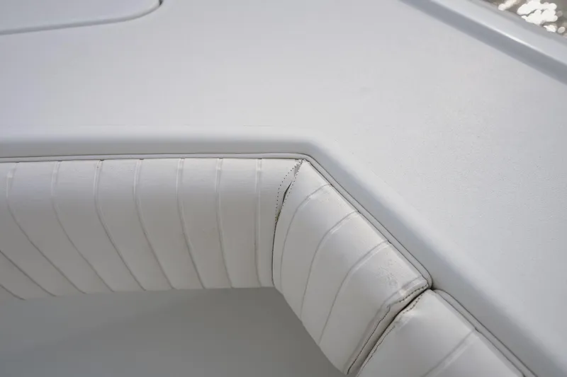  Yacht Photos Pics Close-up of white cushioned seating on a 2018 Freeman 37 VH boat.