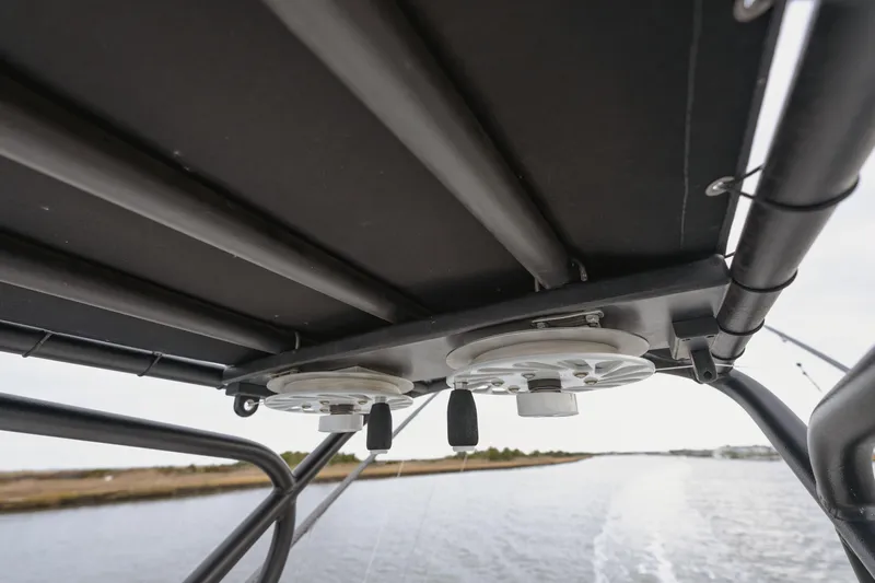  Yacht Photos Pics T-top view of 2018 Freeman 37 VH boat with rod holders on a waterway.