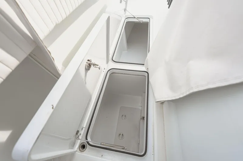  Yacht Photos Pics Open storage compartments on a 2018 Freeman 37 VH boat, showcasing interior space.