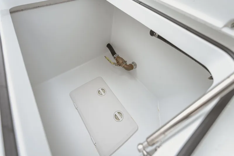  Yacht Photos Pics Freeman 37 VH 2018 boat compartment with plumbing and storage hatch.