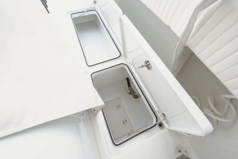  Yacht Photos Pics Open storage compartments on a 2018 Freeman 37 VH boat, showcasing interior details.