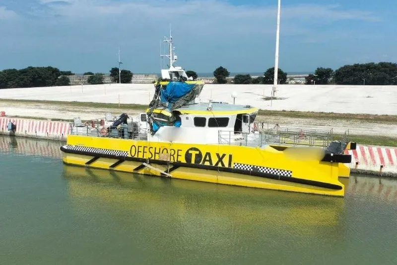  Yacht Photos Pics Yellow Offshore Fast Crew Taxi Catamaran docked, Mützelfeldtwerft model, 2016.