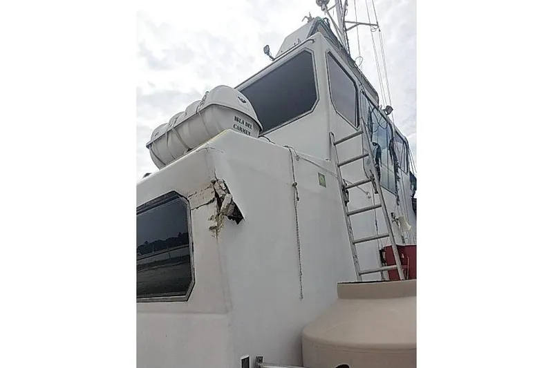  Yacht Photos Pics 2016 Mützelfeldtwerft Offshore Fast Crew Taxi Catamaran with visible damage and ladder.