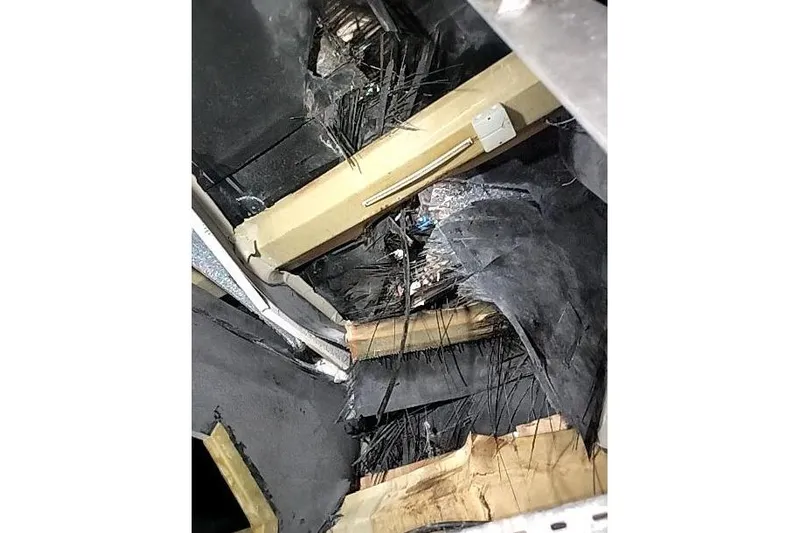  Yacht Photos Pics Damaged interior of 2016 Mützelfeldtwerft Offshore Fast Crew Taxi Catamaran.