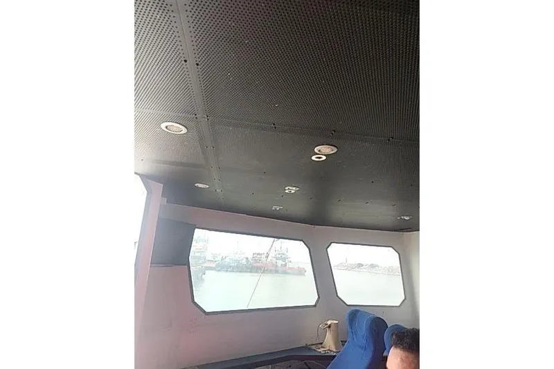  Yacht Photos Pics Interior of 2016 Mützelfeldtwerft Offshore Fast Crew Taxi Catamaran with blue seating.