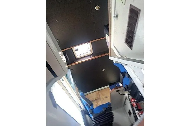  Yacht Photos Pics Interior of a 2016 Mützelfeldtwerft Offshore Fast Crew Taxi Catamaran, featuring seating and hatch.